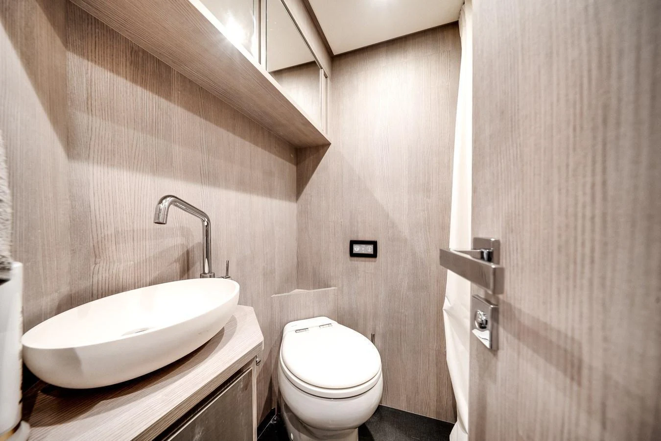 The yacht's head features modern fixtures and a sleek design. aboard PARTNERSHIP V Yacht for Sale