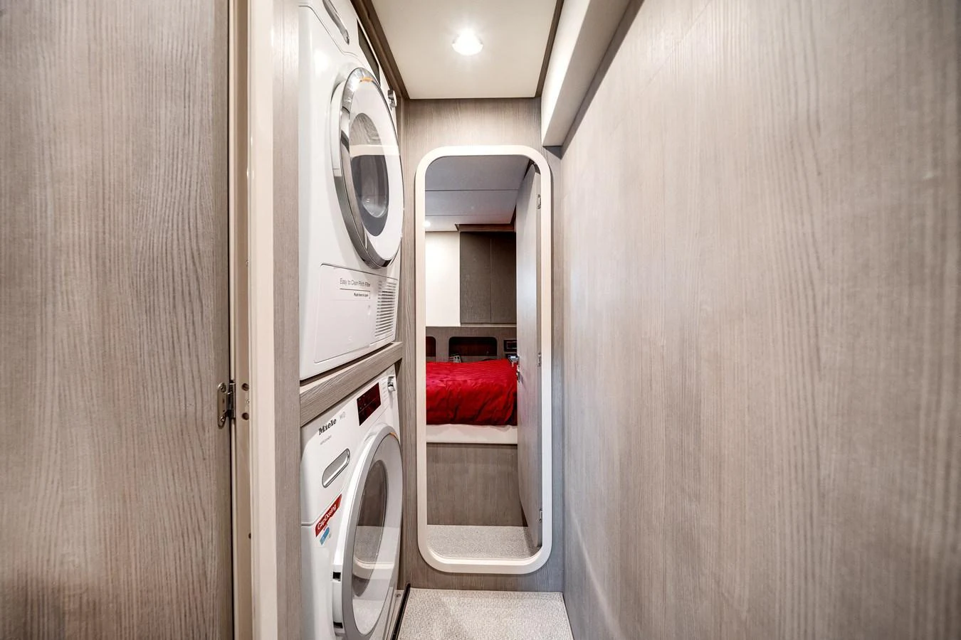 The yacht features a convenient laundry area with modern appliances. aboard PARTNERSHIP V Yacht for Sale