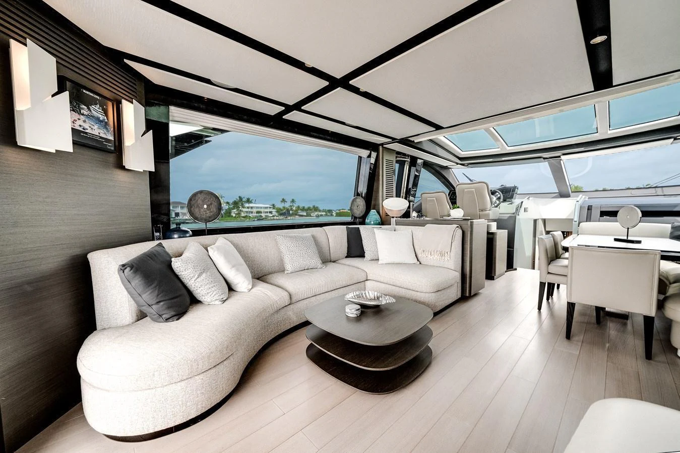 The yacht's salon features a spacious and modern seating area with large windows offering stunning views. aboard PARTNERSHIP V Yacht for Sale
