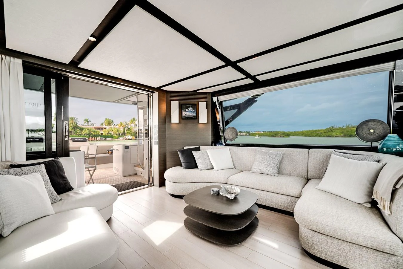 The salon offers a spacious and luxurious seating area with panoramic views. aboard PARTNERSHIP V Yacht for Sale