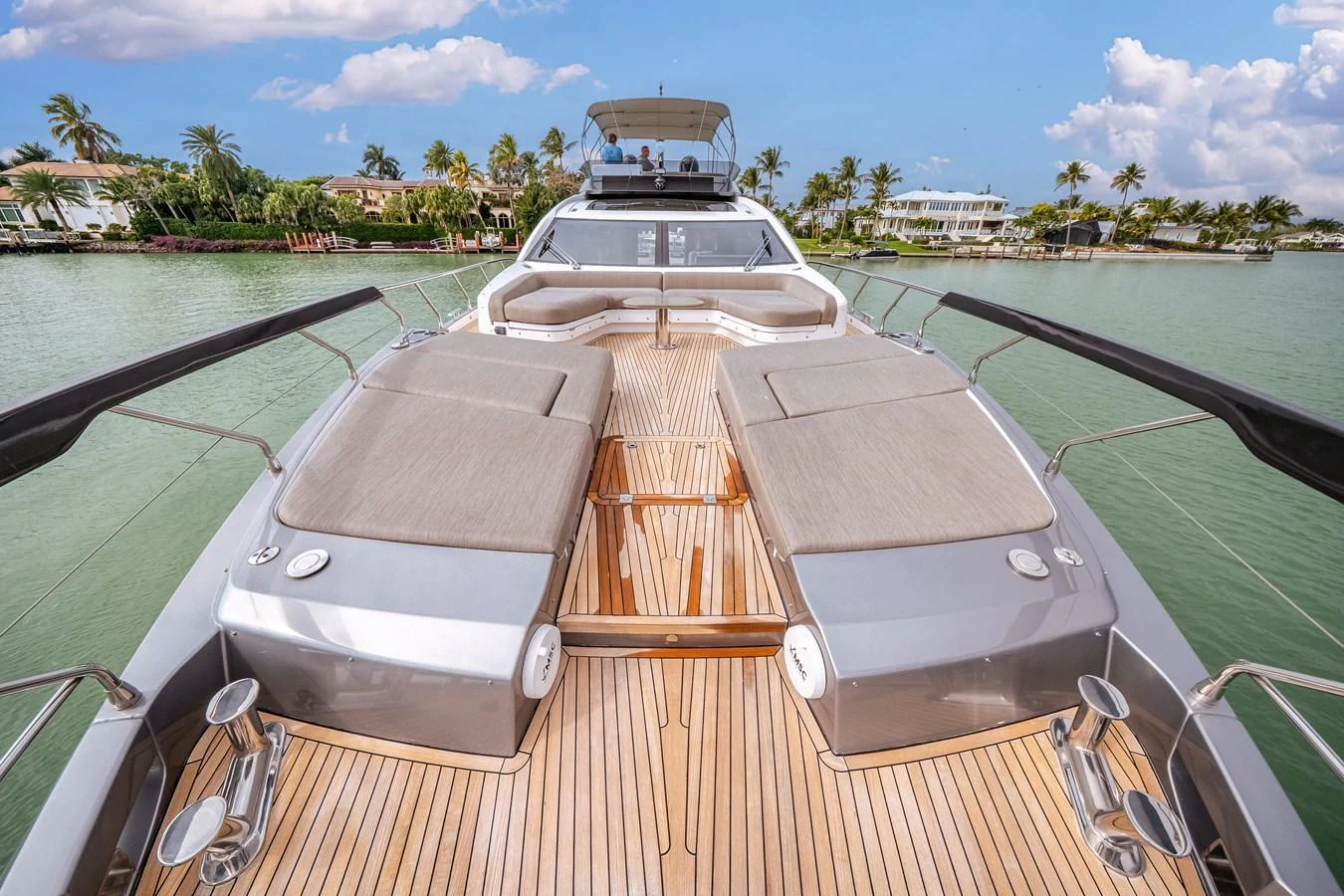 The yacht's foredeck features spacious sun pads and a sleek, modern design. aboard PARTNERSHIP V Yacht for Sale