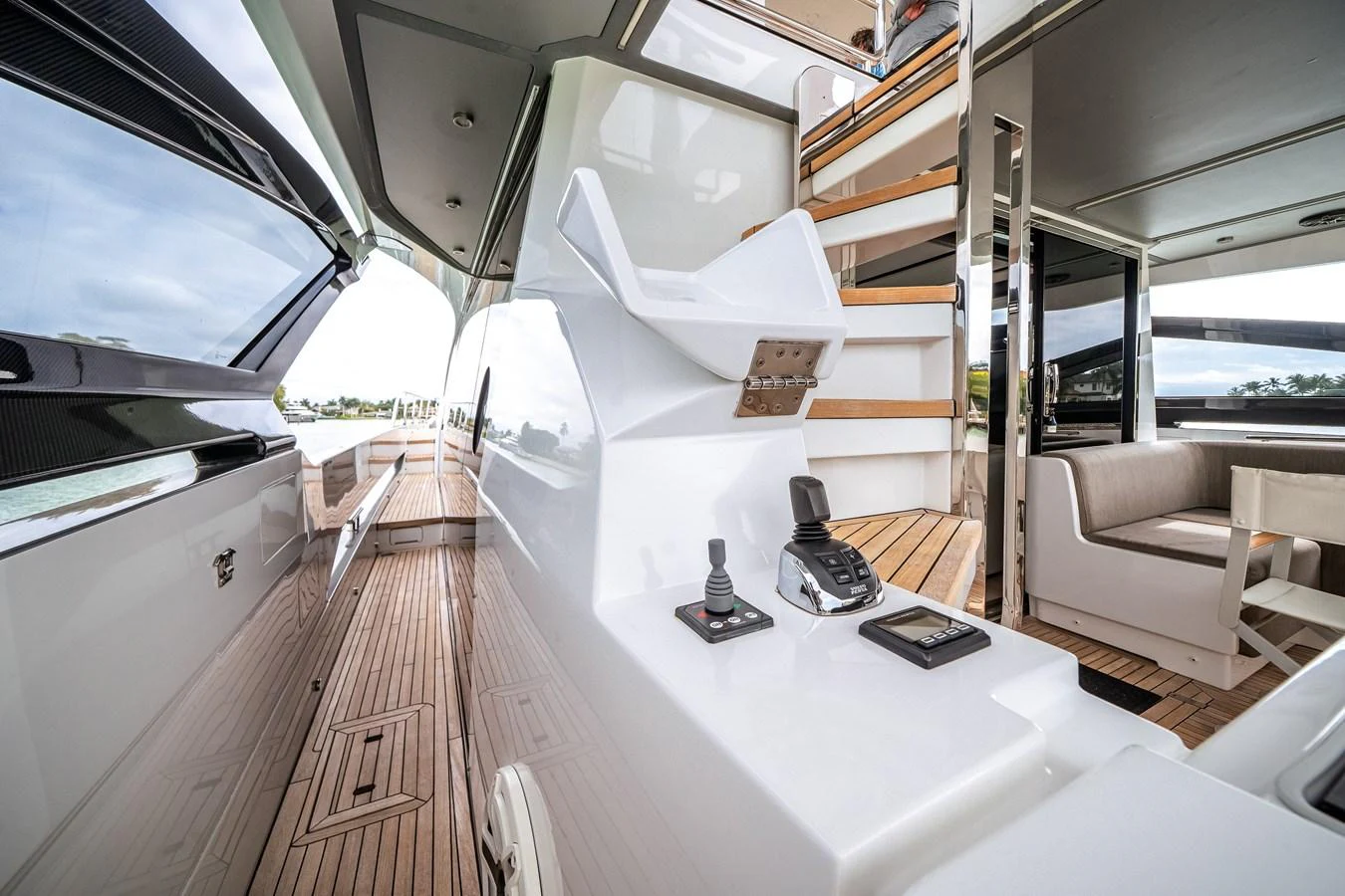The sleek helm station is complemented by modern controls and a stylish staircase leading to the upper deck. aboard PARTNERSHIP V Yacht for Sale