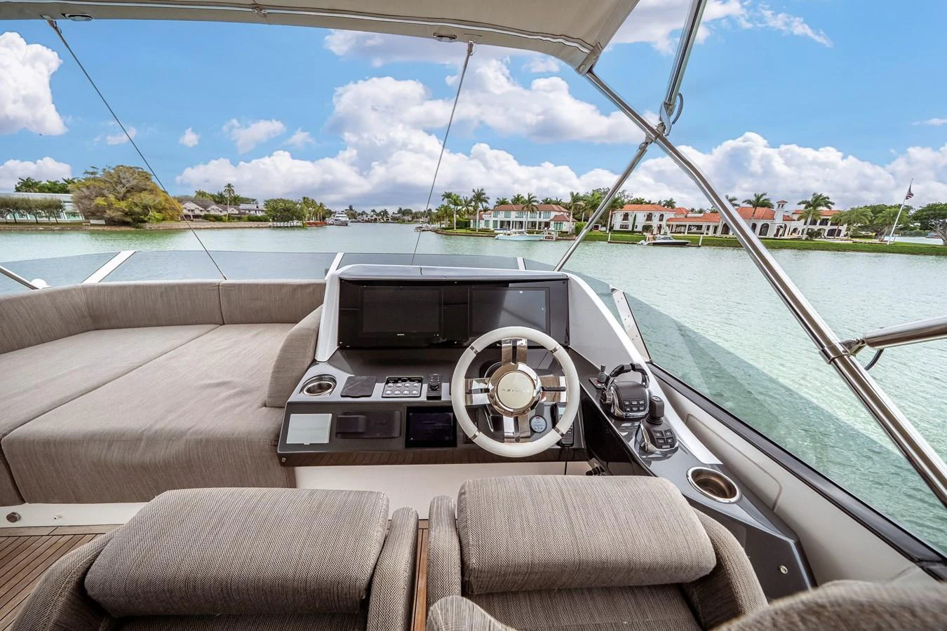 The helm station offers a commanding view with modern navigation equipment and comfortable seating. aboard PARTNERSHIP V Yacht for Sale