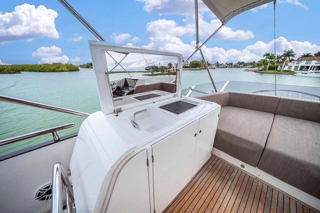The flybridge offers a comfortable seating area with a view of the serene waters and surrounding landscape. aboard PARTNERSHIP V Yacht for Sale