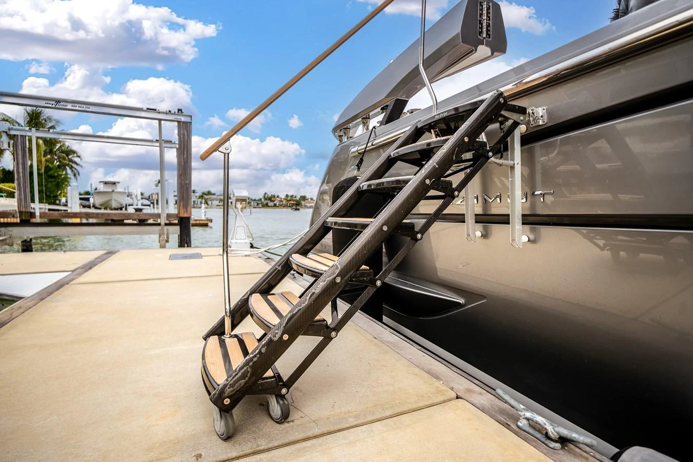 A close-up view of the yacht's boarding ladder extending onto the dock. aboard PARTNERSHIP V Yacht for Sale