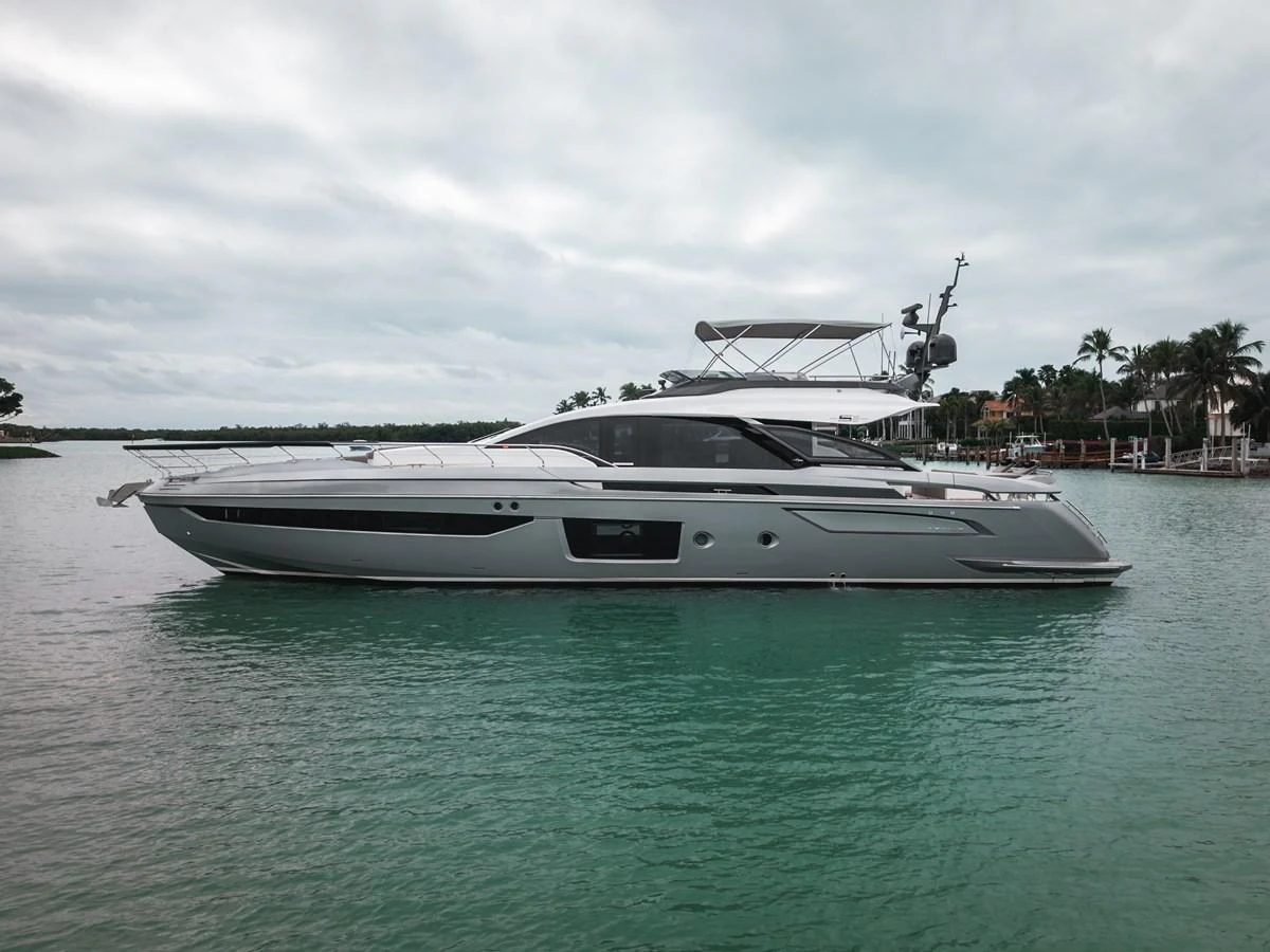 A sleek and modern yacht glides gracefully on calm waters, showcasing its elegant design. aboard PARTNERSHIP V Yacht for Sale