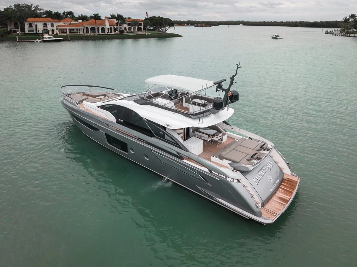 A sleek and modern yacht cruising on calm waters with a luxurious design and spacious deck areas. aboard PARTNERSHIP V Yacht for Sale