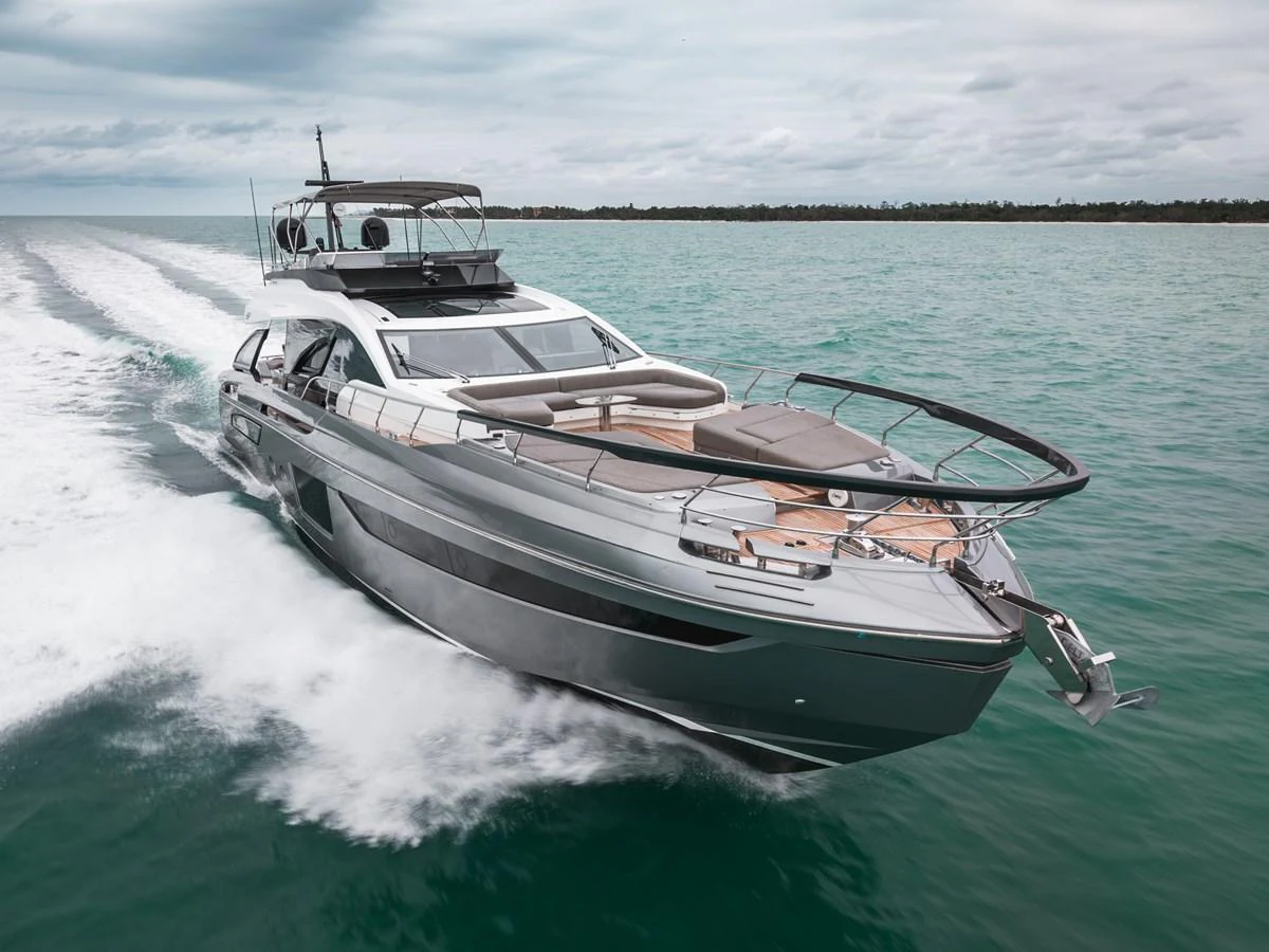 A sleek and modern yacht cruises swiftly through the water, showcasing its elegant design and spacious deck. aboard PARTNERSHIP V Yacht for Sale
