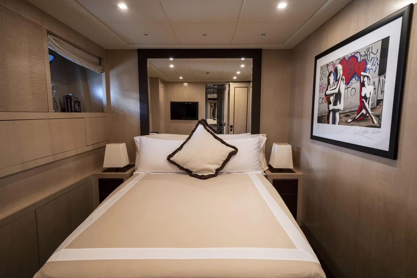 A cozy stateroom featuring a comfortable bed and modern decor. aboard MANU Yacht for Sale