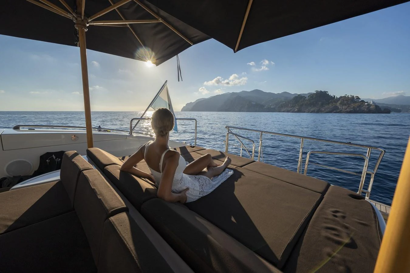 A serene sundeck with a comfortable lounging area, perfect for soaking up the sun and enjoying the scenic views. aboard MANU Yacht for Sale