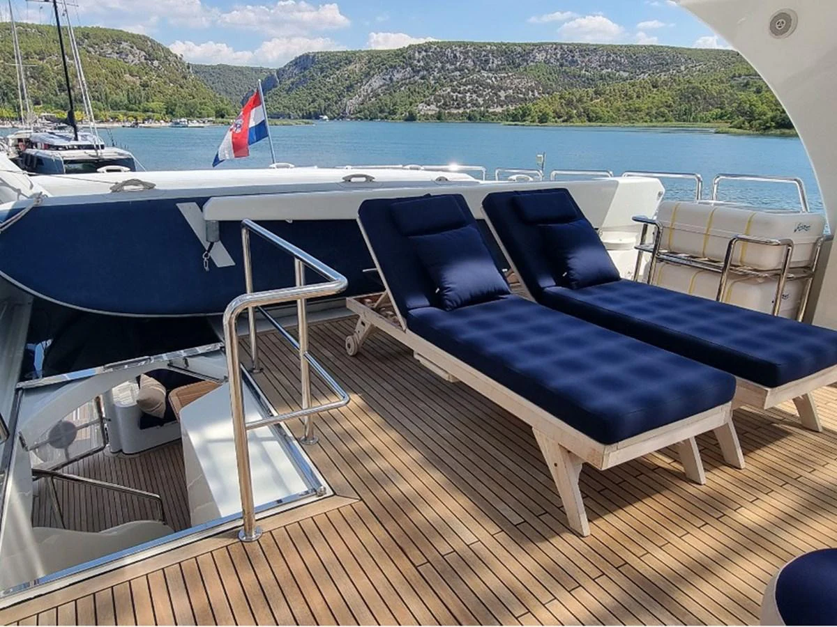 The sundeck features comfortable lounge chairs with a scenic view of the surrounding waters. aboard LADY TATIANA Yacht for Sale