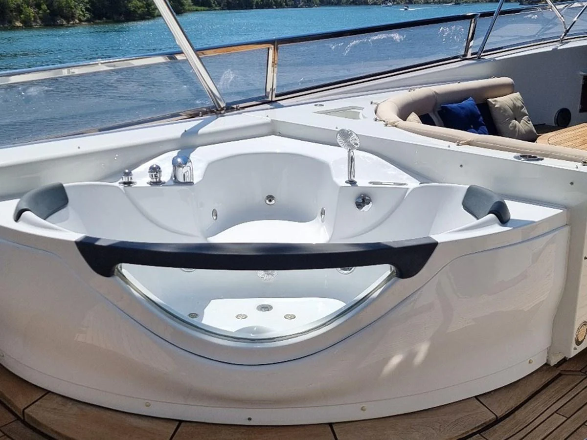 The yacht features a luxurious jacuzzi on the deck, offering stunning views of the surrounding waters. aboard LADY TATIANA Yacht for Sale
