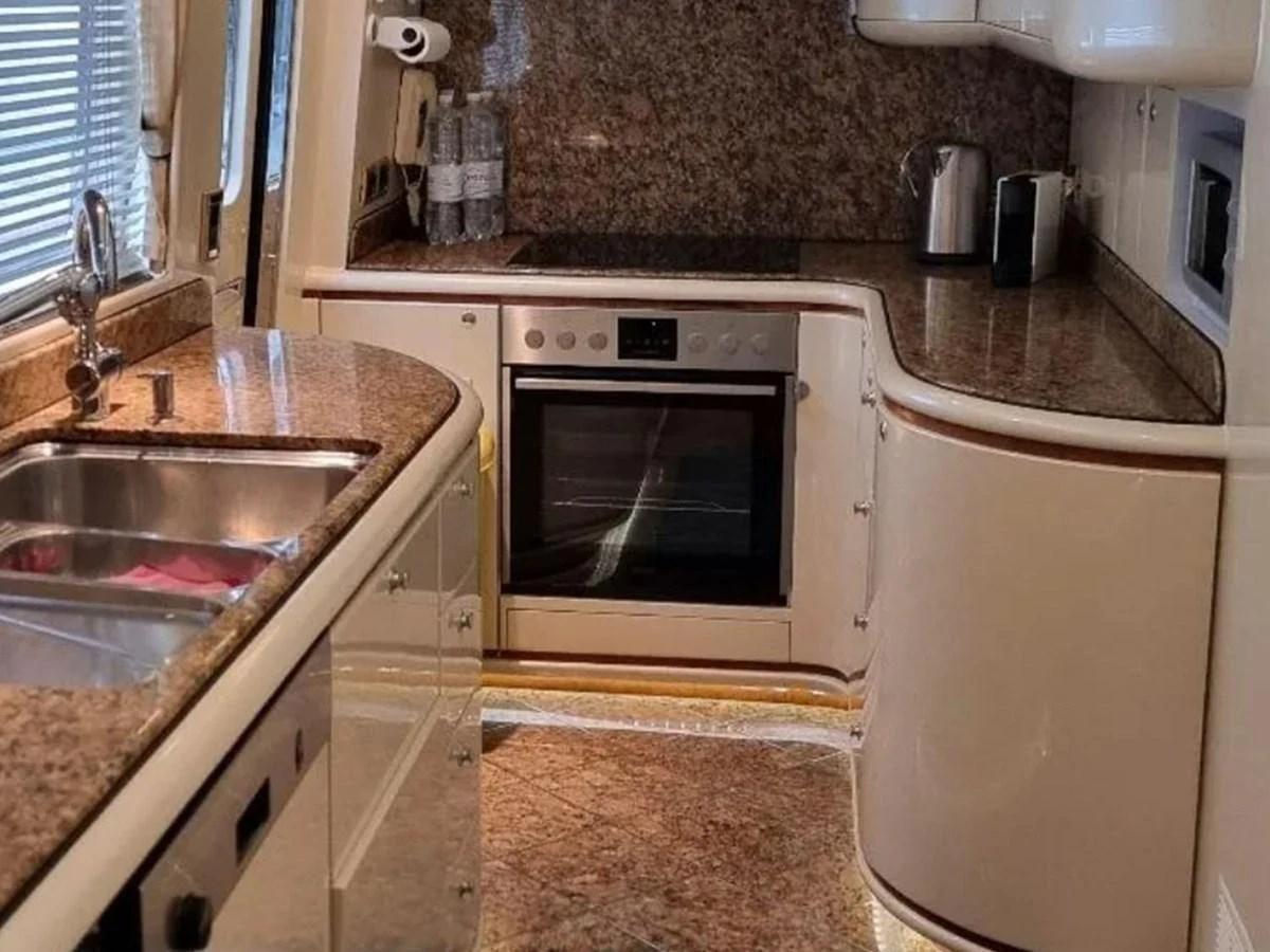 The yacht's galley features modern appliances and elegant granite countertops. aboard LADY TATIANA Yacht for Sale