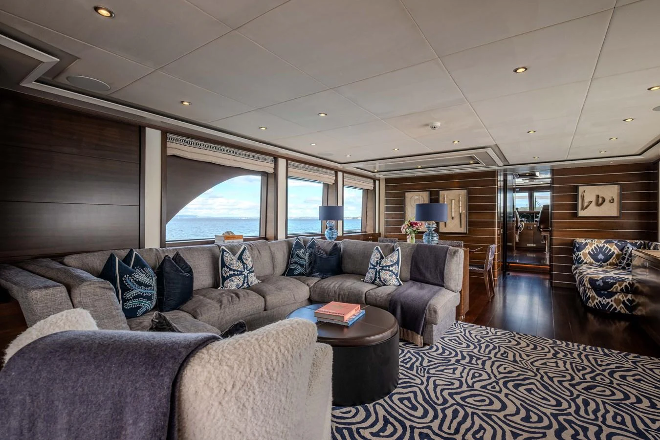 a living room with a large window aboard MAHALO Yacht for Sale