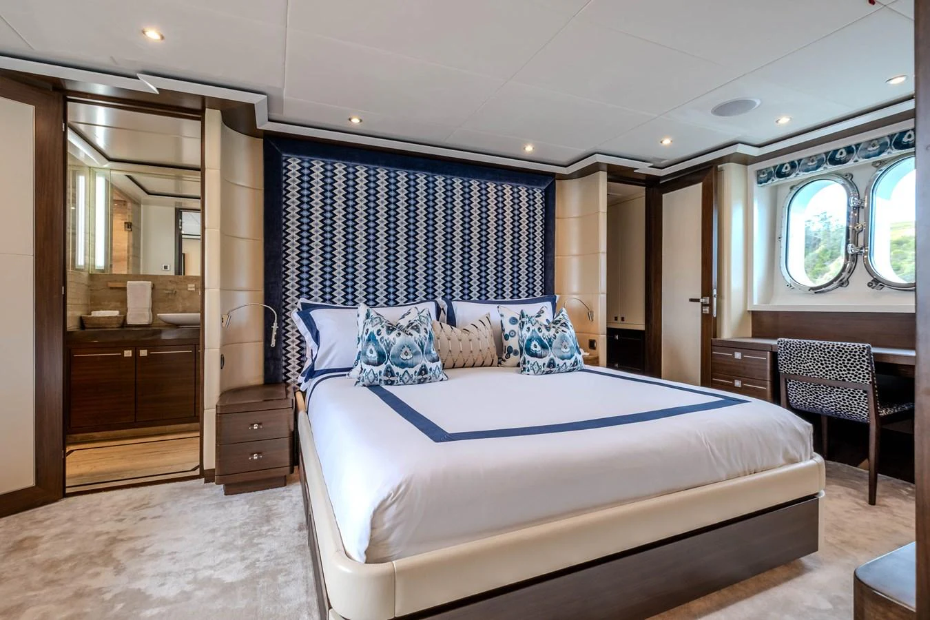 a large bedroom with a bed aboard MAHALO Yacht for Sale