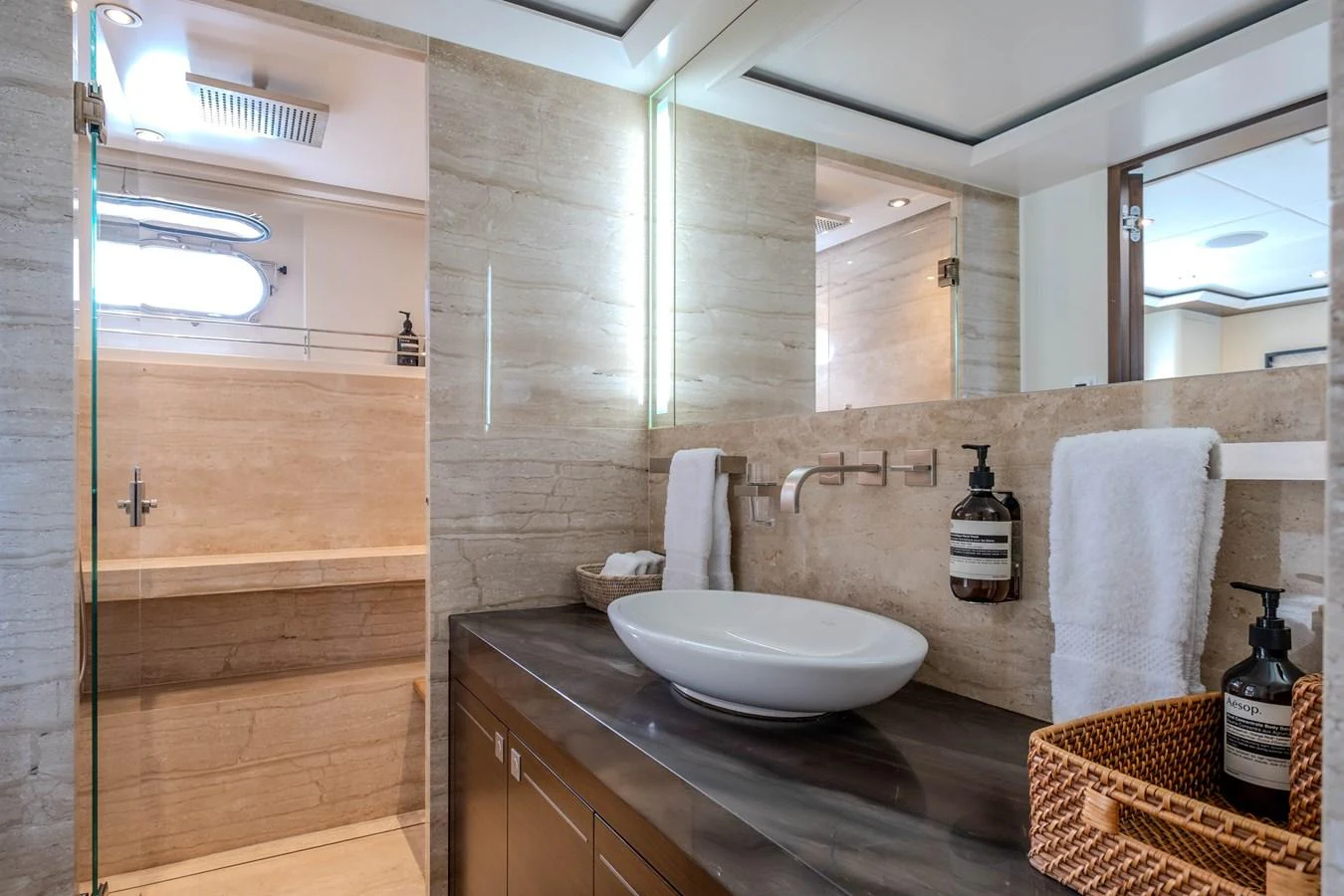 a bathroom with a sink and a mirror aboard MAHALO Yacht for Sale