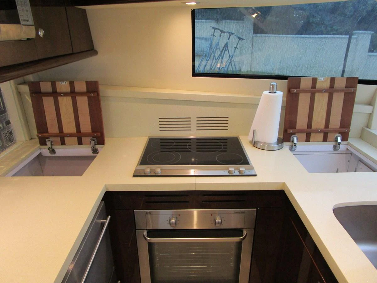 The yacht's galley features modern appliances and ample counter space for meal preparation. aboard SHORE GIRL Yacht for Sale