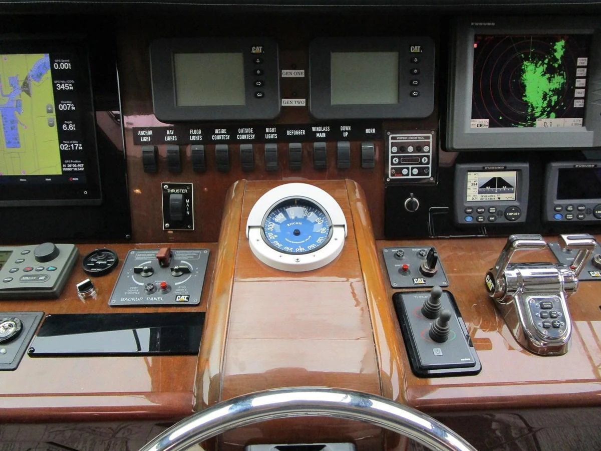 The helm station features advanced navigation and control systems for precise yacht handling. aboard SHORE GIRL Yacht for Sale
