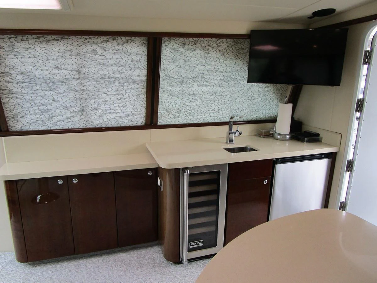 The galley features modern appliances and sleek cabinetry, creating a functional and stylish space. aboard SHORE GIRL Yacht for Sale