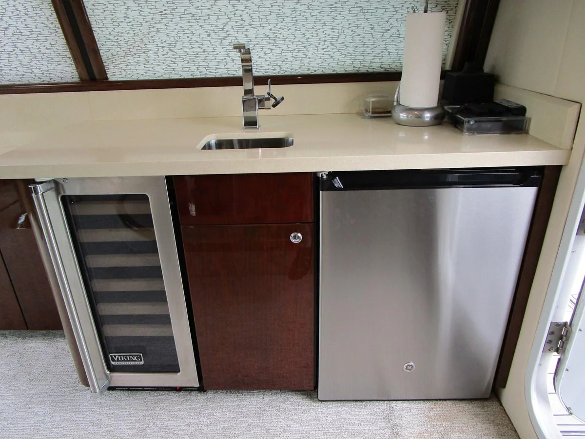 The galley features modern appliances and a sleek countertop for a refined culinary experience. aboard SHORE GIRL Yacht for Sale