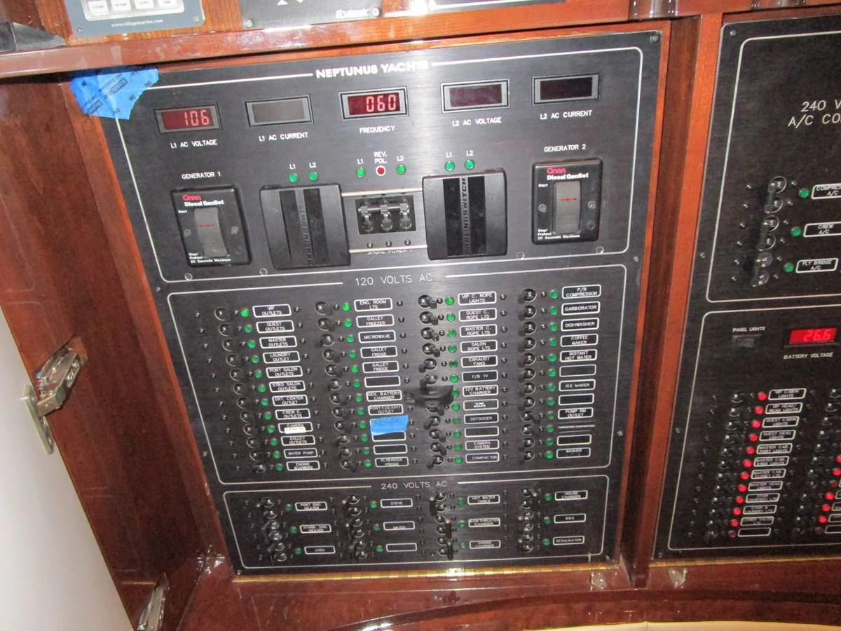 The image showcases the yacht's electrical control panel with various switches and indicators. aboard SHORE GIRL Yacht for Sale
