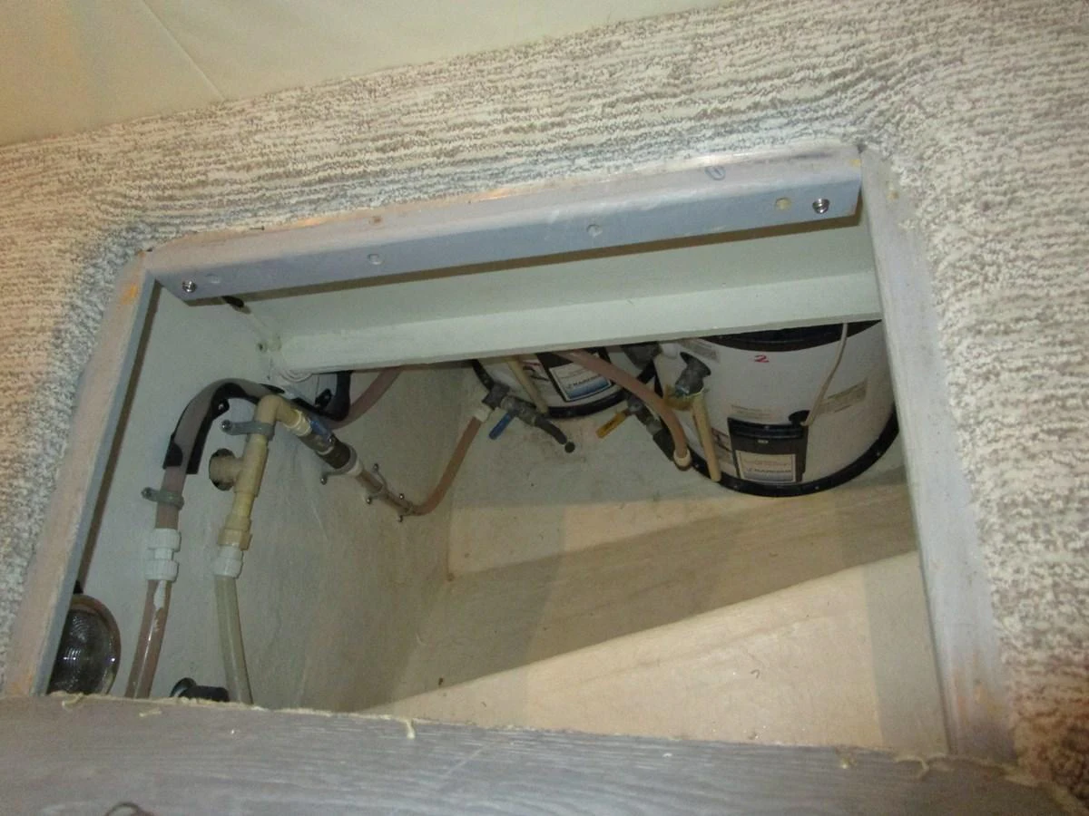A detailed view of the yacht's mechanical compartment, showcasing plumbing and equipment. aboard SHORE GIRL Yacht for Sale