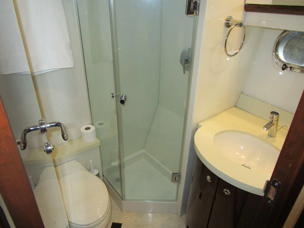A compact and well-appointed yacht bathroom with modern fixtures. aboard SHORE GIRL Yacht for Sale