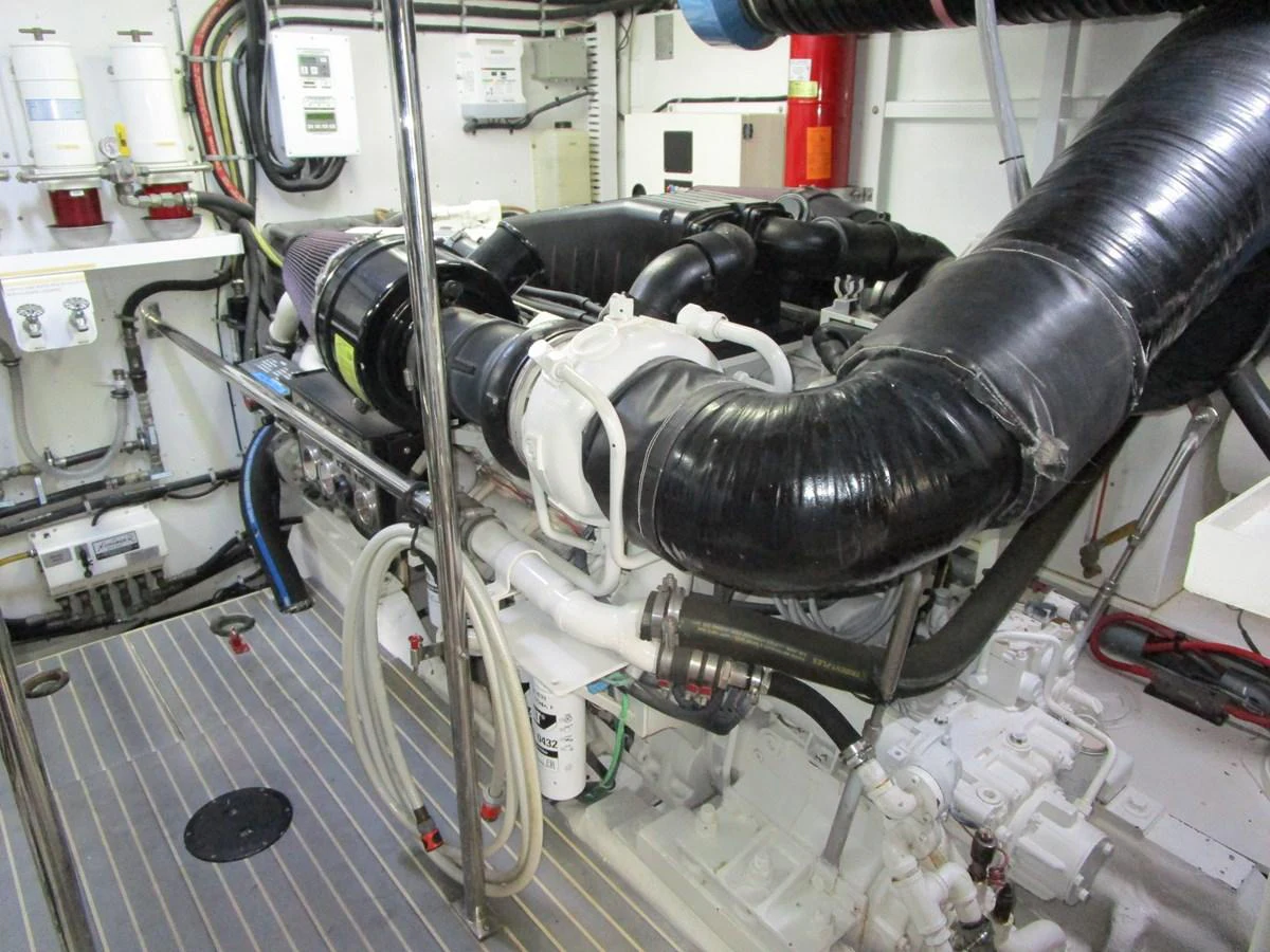 The image showcases the well-maintained engine room of the yacht, highlighting its mechanical components and systems. aboard SHORE GIRL Yacht for Sale