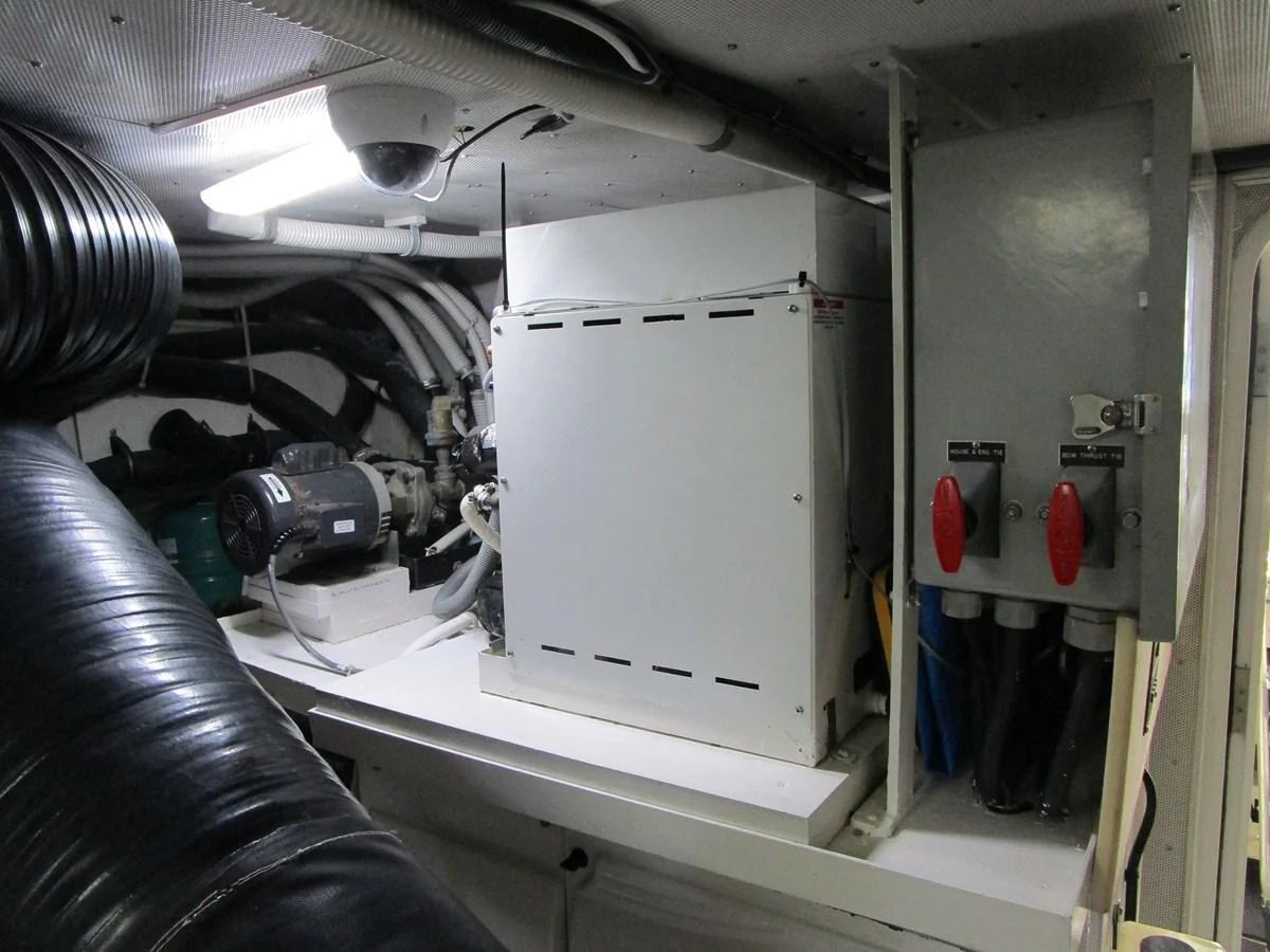 The image showcases the engine room with various mechanical and electrical components. aboard SHORE GIRL Yacht for Sale