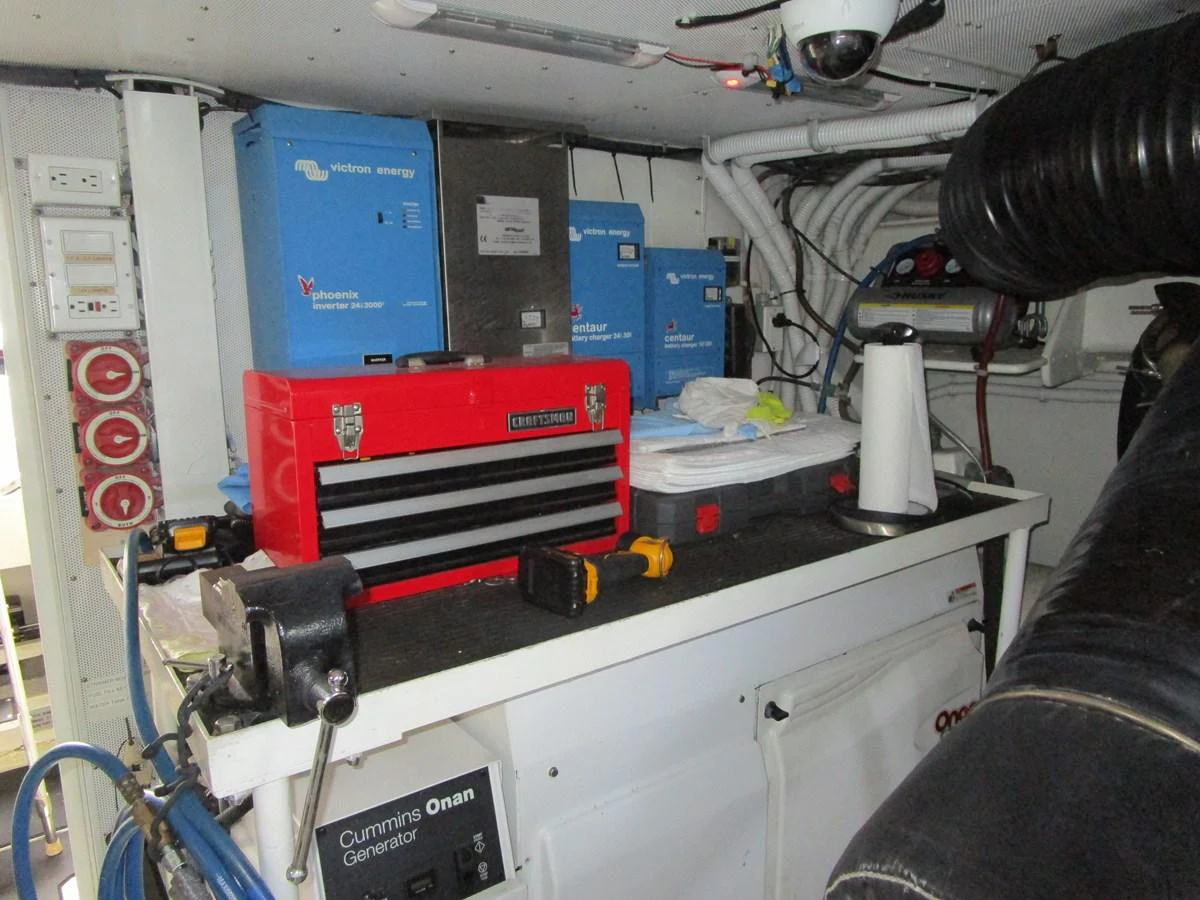The image shows a well-organized engine room with various equipment and tools. aboard SHORE GIRL Yacht for Sale