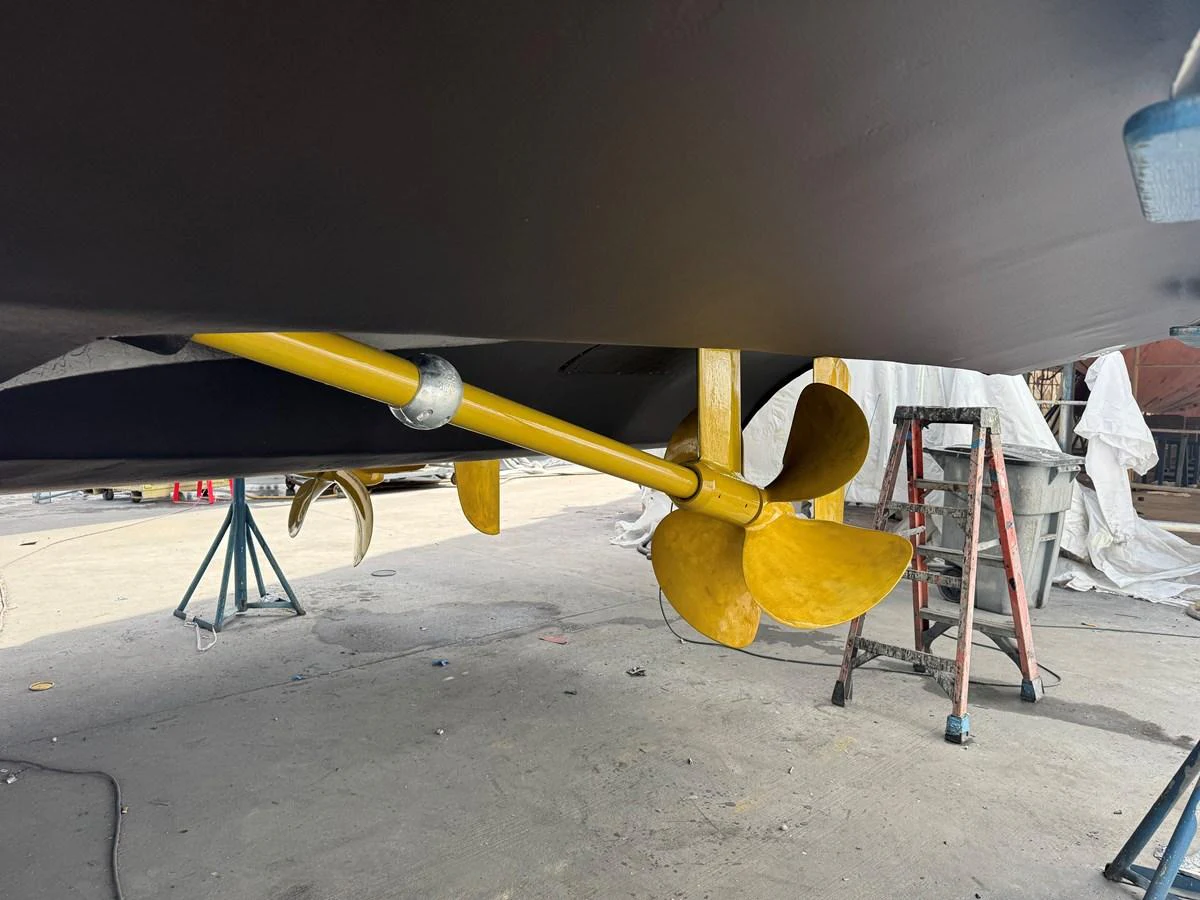 The image showcases the yacht's propeller and shaft during maintenance. aboard SHORE GIRL Yacht for Sale