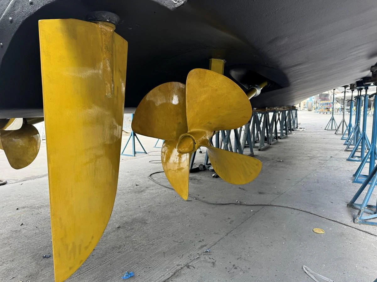 The image showcases the yacht's propeller and rudder system while it is on dry dock. aboard SHORE GIRL Yacht for Sale