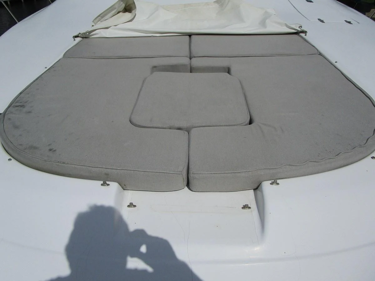 The image shows a close-up of a cushioned sunbathing area on the yacht's deck. aboard SHORE GIRL Yacht for Sale
