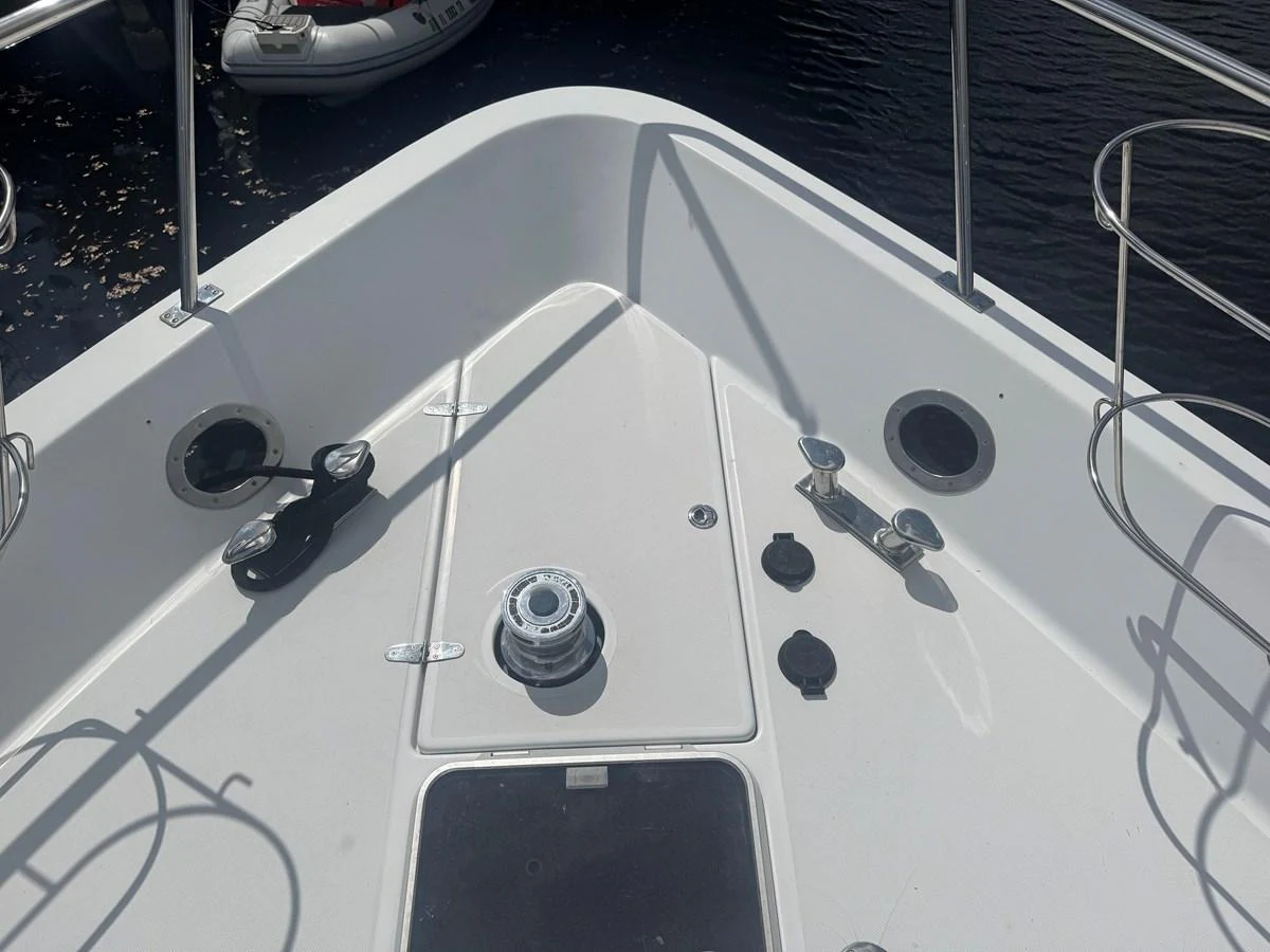 The image showcases the bow area of a yacht with various deck fittings and equipment. aboard SHORE GIRL Yacht for Sale