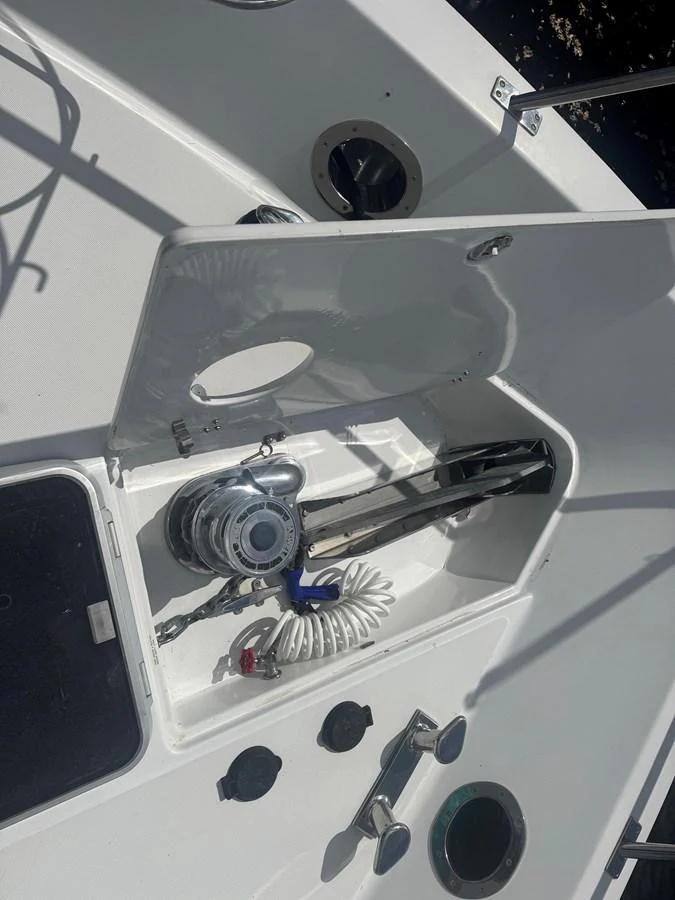 The image showcases a detailed view of a yacht's anchor locker with various equipment neatly stored. aboard SHORE GIRL Yacht for Sale