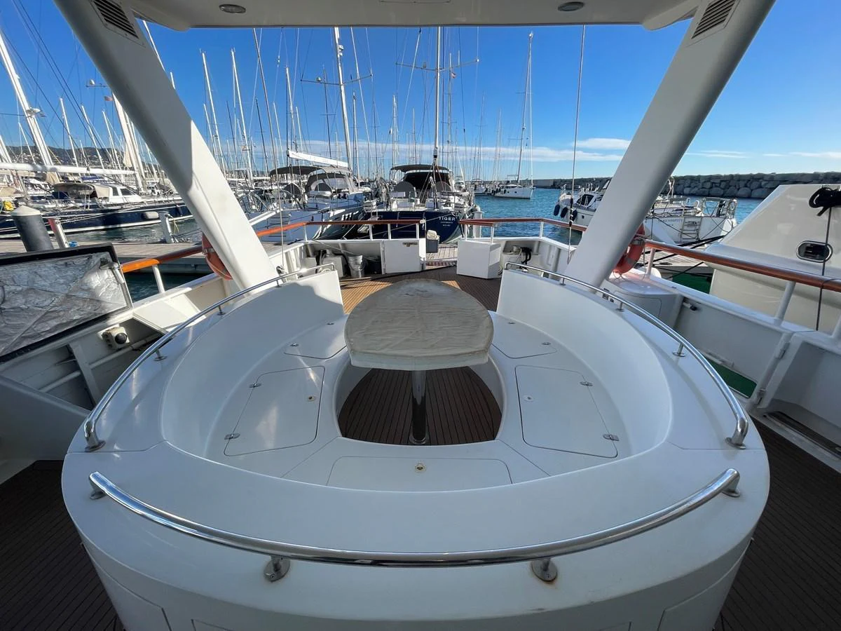 The aft deck features a spacious seating area with a central table, perfect for outdoor relaxation and dining. aboard ATB MAROC  CUSTOM MOTOR YACHT Yacht for Sale