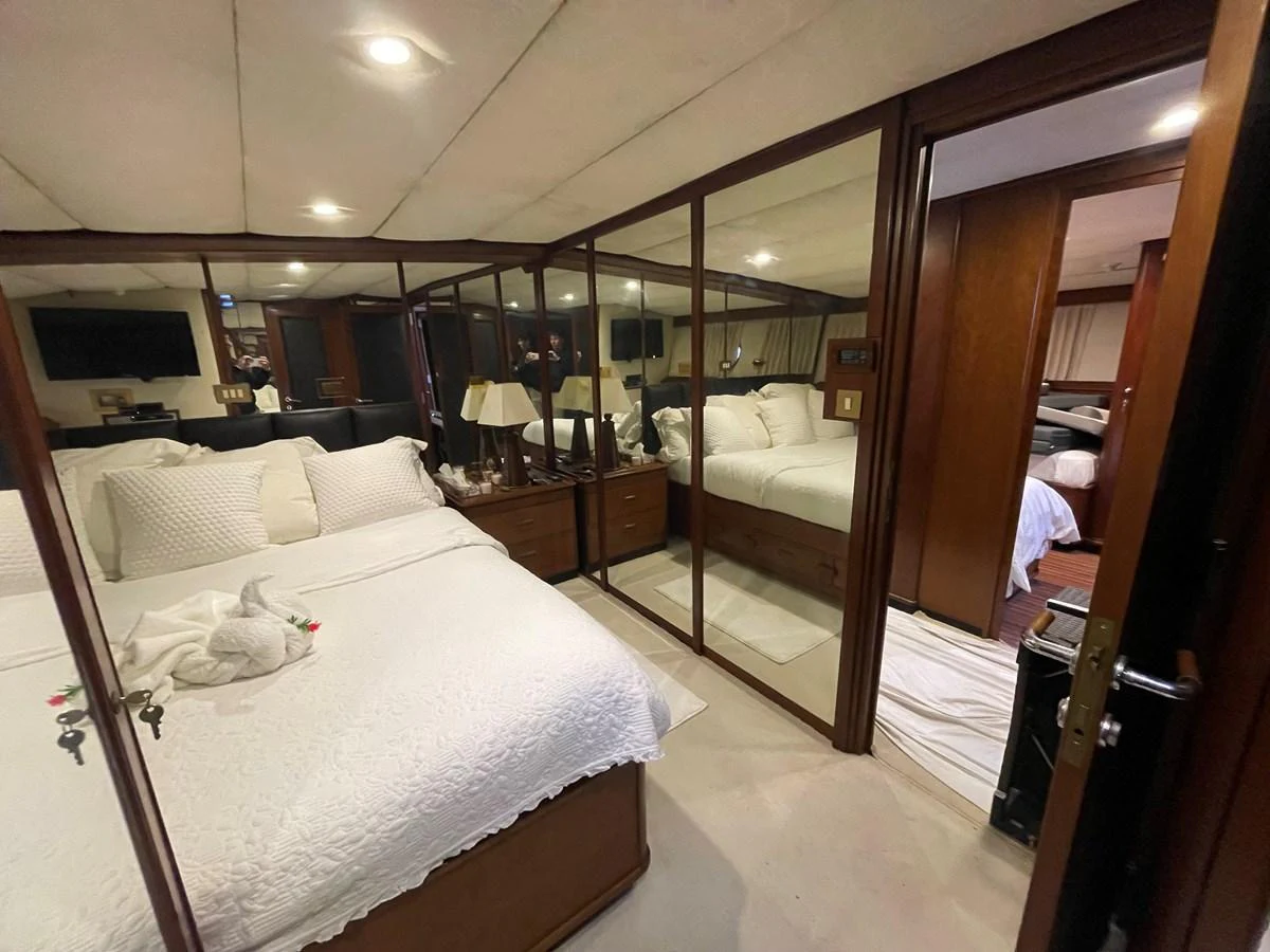 The stateroom features a cozy bed with elegant bedding and ample storage space, creating a comfortable and inviting atmosphere. aboard ATB MAROC  CUSTOM MOTOR YACHT Yacht for Sale