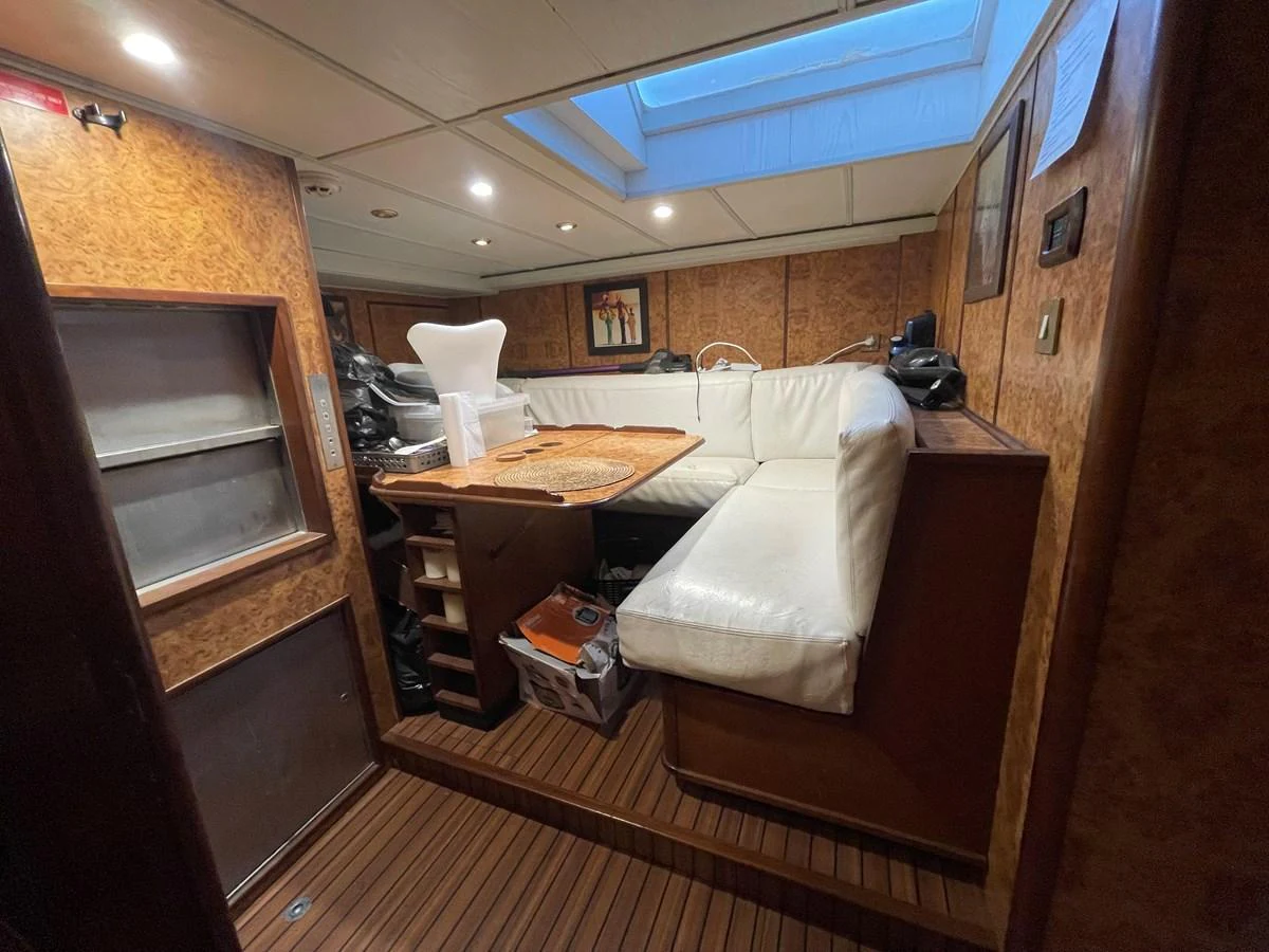The cozy interior features a comfortable seating area with a skylight providing natural light. aboard ATB MAROC  CUSTOM MOTOR YACHT Yacht for Sale