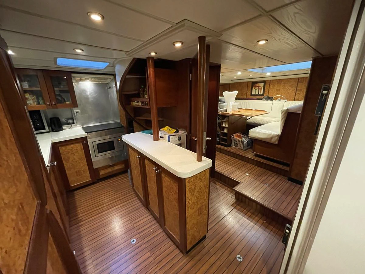 The yacht's galley features a well-equipped kitchen area with ample counter space and a cozy dining nook. aboard ATB MAROC  CUSTOM MOTOR YACHT Yacht for Sale
