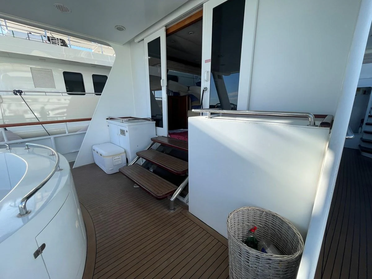 The aft deck features a cozy seating area with easy access to the interior. aboard ATB MAROC  CUSTOM MOTOR YACHT Yacht for Sale