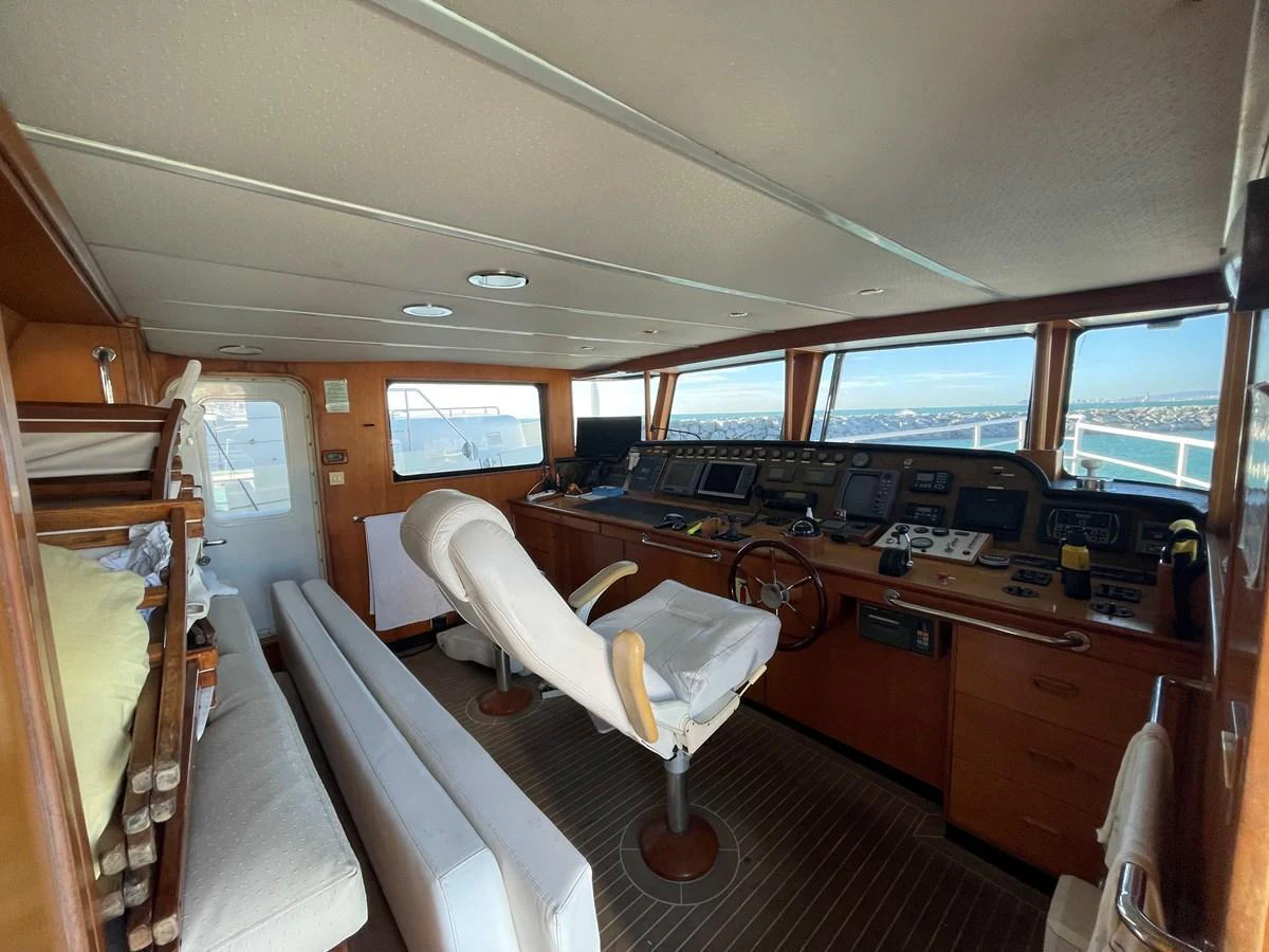 The helm of the yacht features a well-equipped control station with panoramic views. aboard ATB MAROC  CUSTOM MOTOR YACHT Yacht for Sale