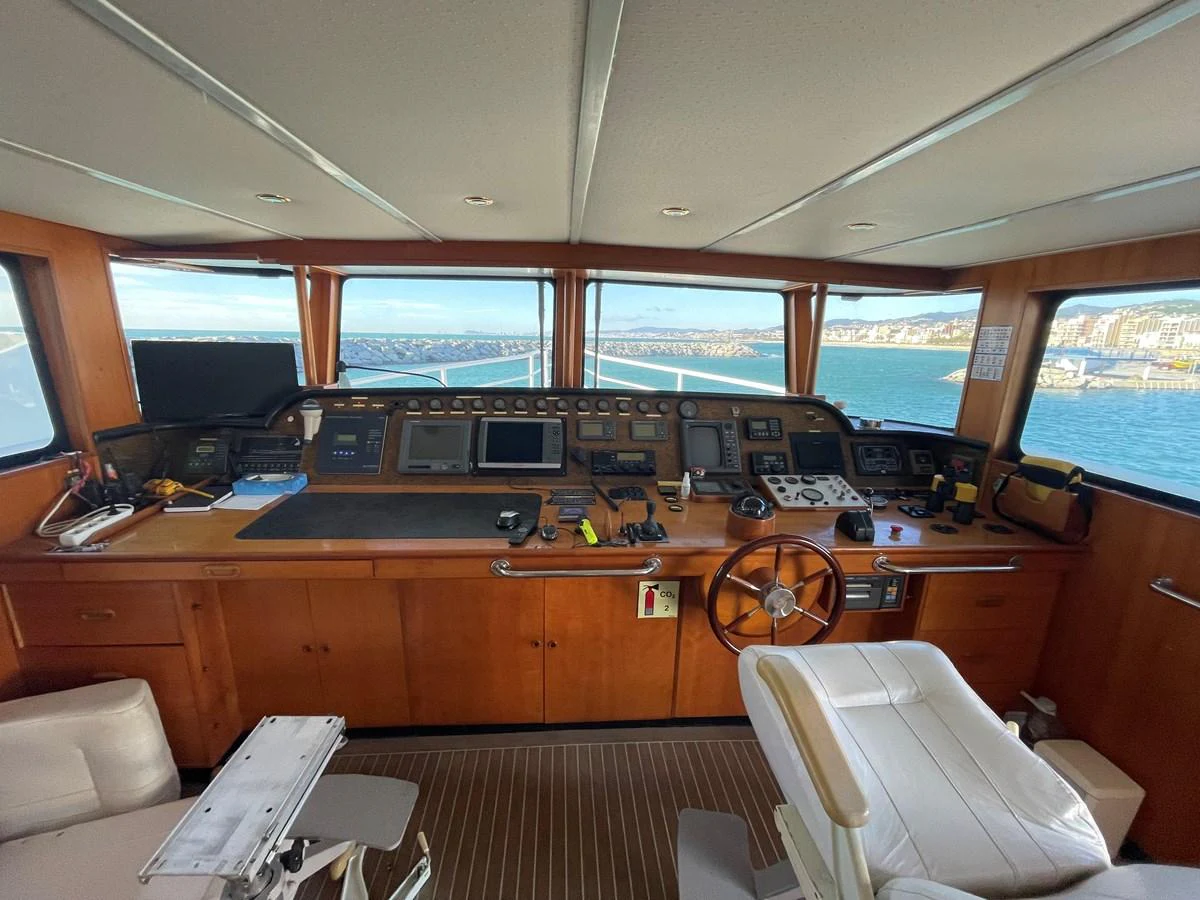 The helm station offers a commanding view with state-of-the-art navigation equipment and luxurious seating. aboard ATB MAROC  CUSTOM MOTOR YACHT Yacht for Sale