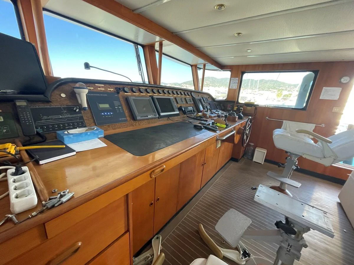 The helm station features a comprehensive array of navigation equipment and comfortable seating. aboard ATB MAROC  CUSTOM MOTOR YACHT Yacht for Sale