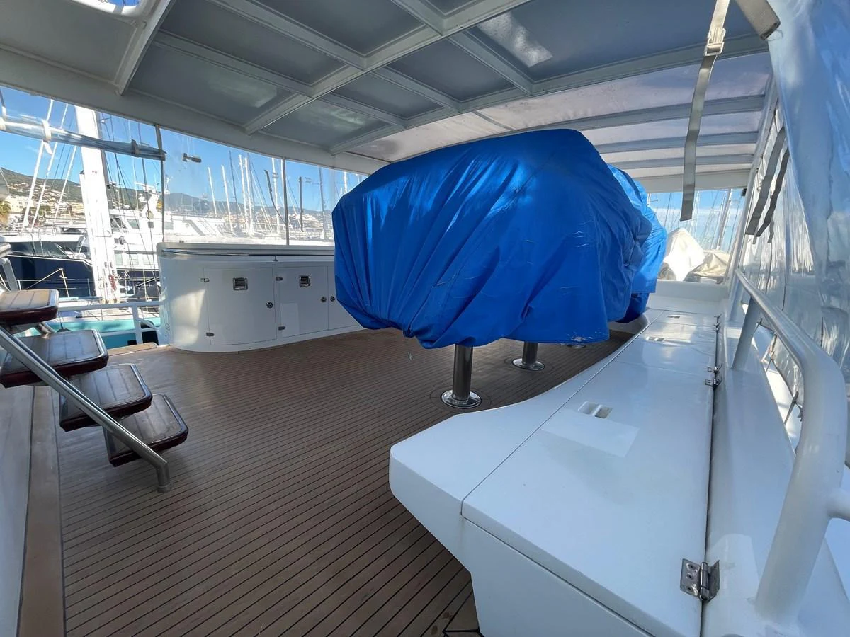 The flybridge features a spacious deck with covered seating and a protected area for equipment. aboard ATB MAROC  CUSTOM MOTOR YACHT Yacht for Sale