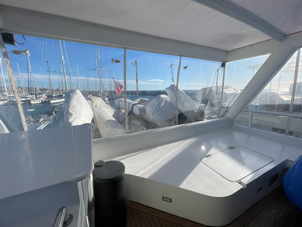 The enclosed deck offers a sheltered space with panoramic views of the marina. aboard ATB MAROC  CUSTOM MOTOR YACHT Yacht for Sale
