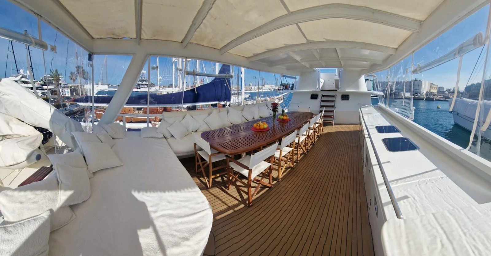 The spacious aft deck features a large dining table and comfortable seating, perfect for alfresco dining and relaxation. aboard ATB MAROC  CUSTOM MOTOR YACHT Yacht for Sale