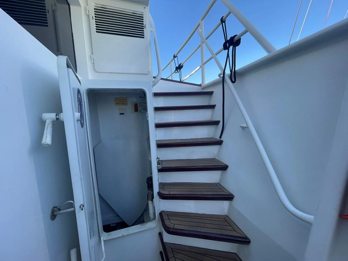 A close-up view of a staircase on the yacht, leading to an upper deck. aboard ATB MAROC  CUSTOM MOTOR YACHT Yacht for Sale