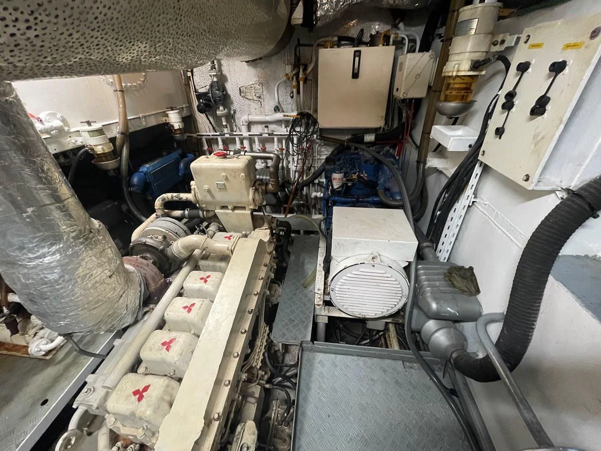 The image showcases the yacht's well-maintained engine room with various mechanical components and systems. aboard ATB MAROC  CUSTOM MOTOR YACHT Yacht for Sale