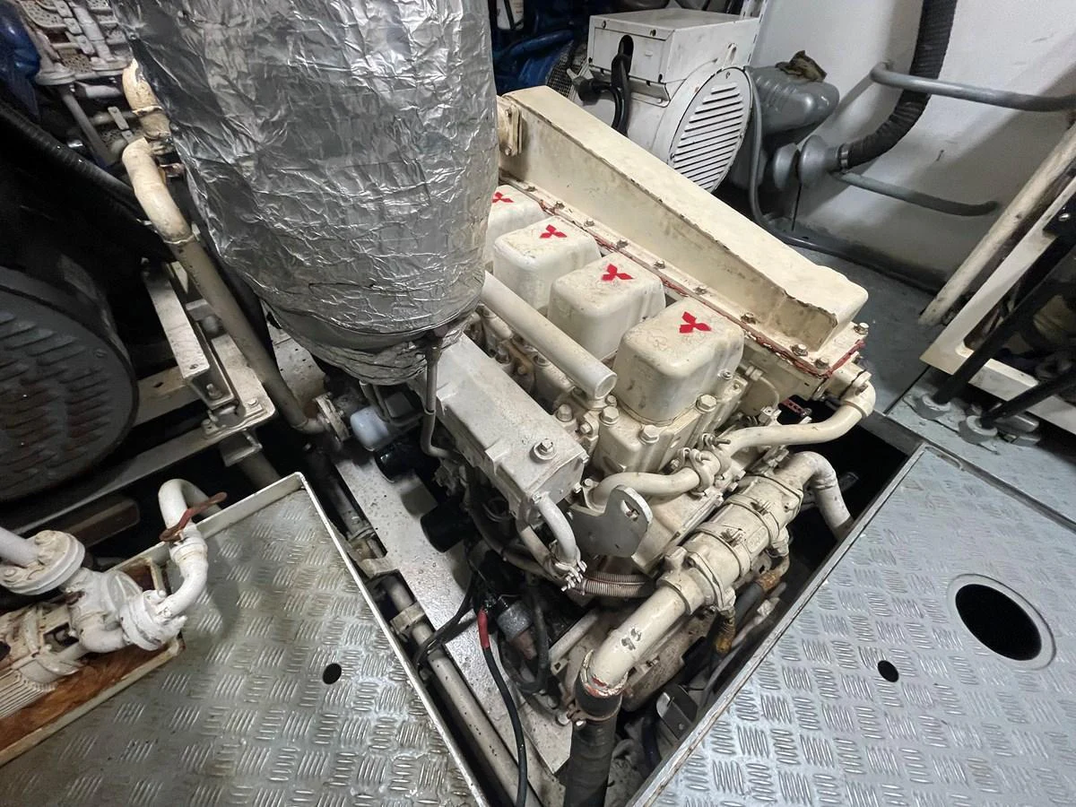 The image showcases the engine room with a detailed view of the yacht's machinery. aboard ATB MAROC  CUSTOM MOTOR YACHT Yacht for Sale