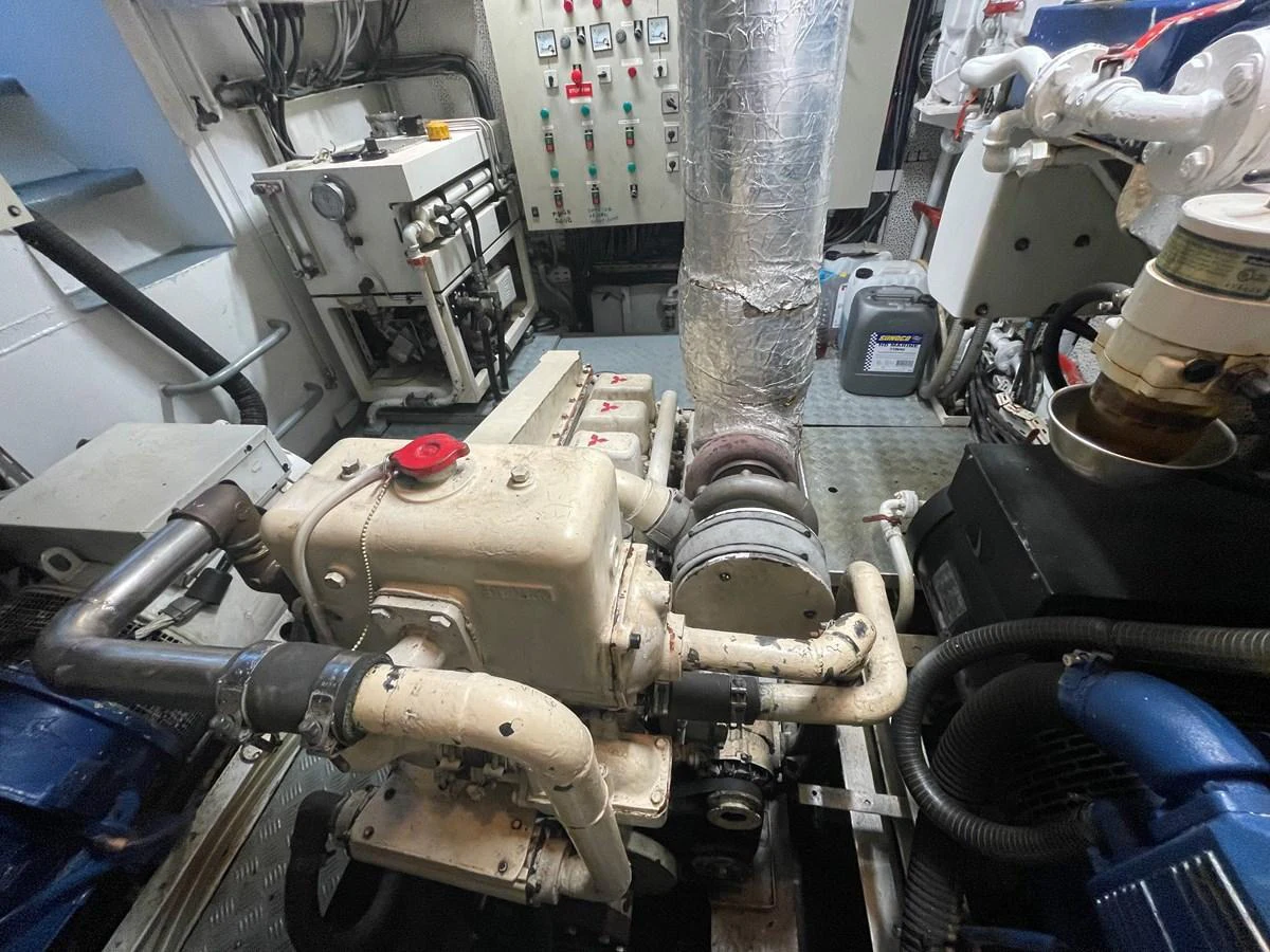 The image showcases the yacht's well-maintained engine room with visible machinery and control panels. aboard ATB MAROC  CUSTOM MOTOR YACHT Yacht for Sale